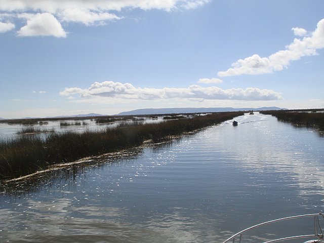 Taking a boat out to the floating islands, Lake Titicaca, Peru